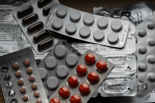 pexels-photo-208512-208512 Close-up of various pills in blister packs showcasing medical and healthcare themes.